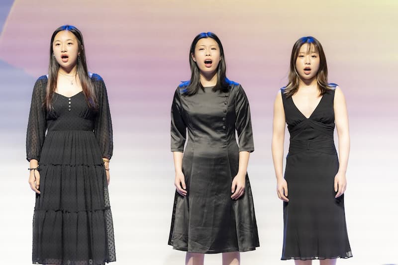 Audience-view concert highlight: HanOpera student vocal performance on stage in Plano, Texas