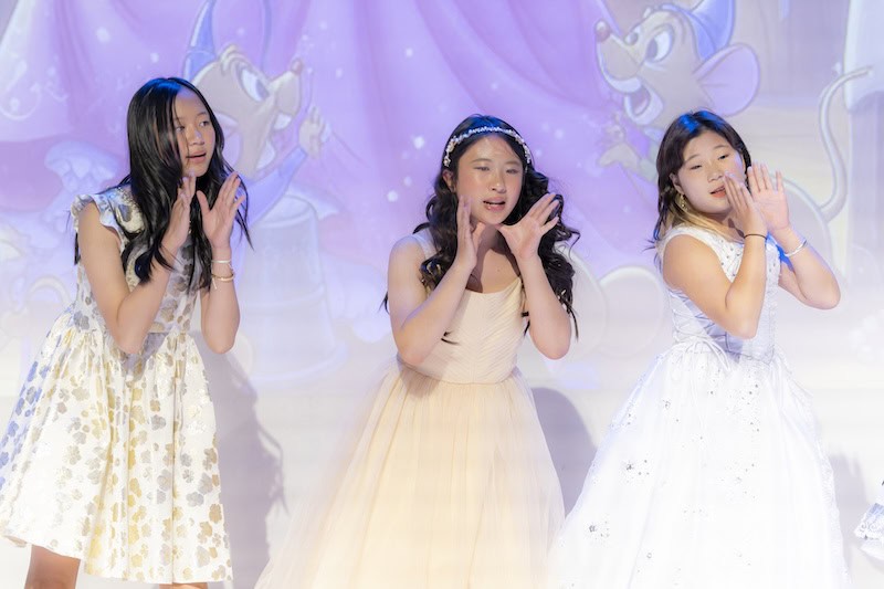 Concert highlight showing stage lighting and student vocal performance at HanOpera and IAMA event in Plano