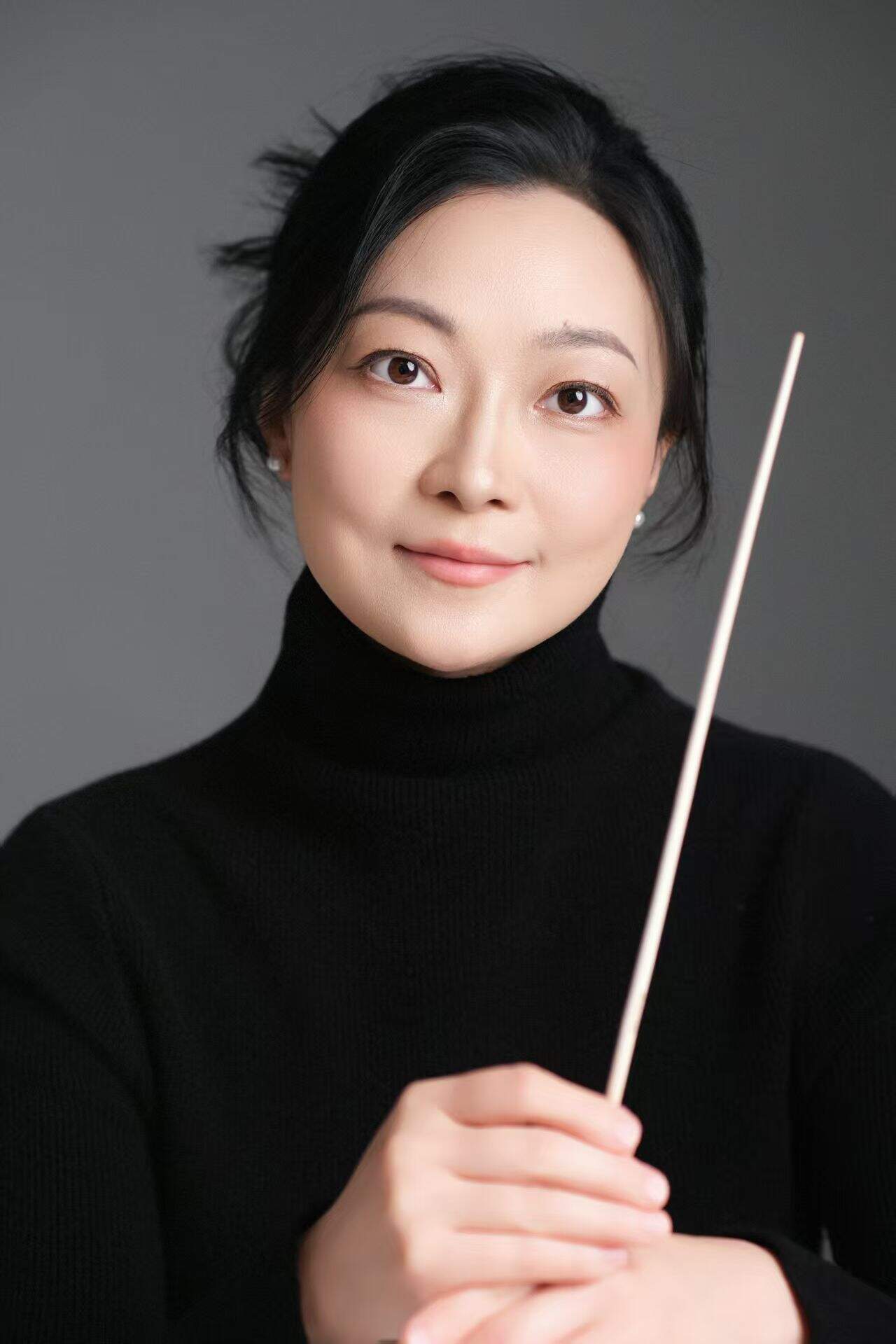 Dr. Ziyun Li, Chorus and Ensemble Director at HanOpera Music Academy in Plano, Texas